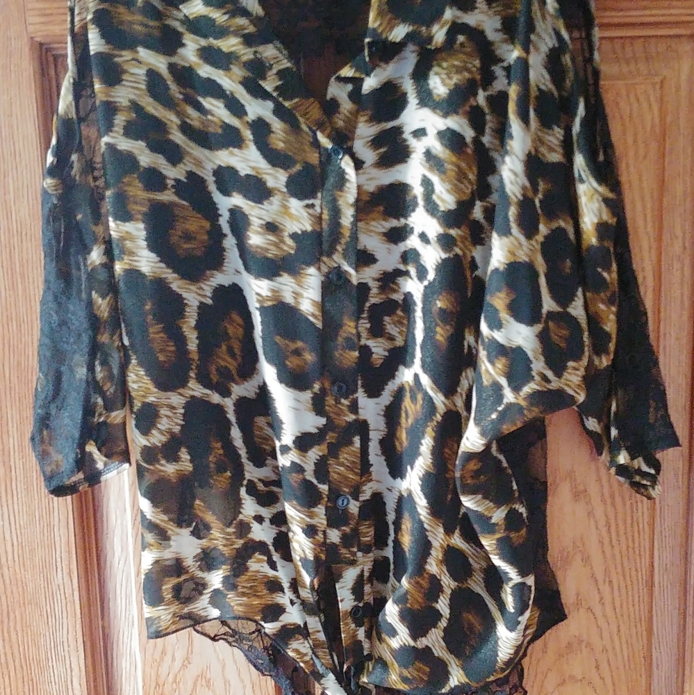 Stunning blouse with lacy detail on back